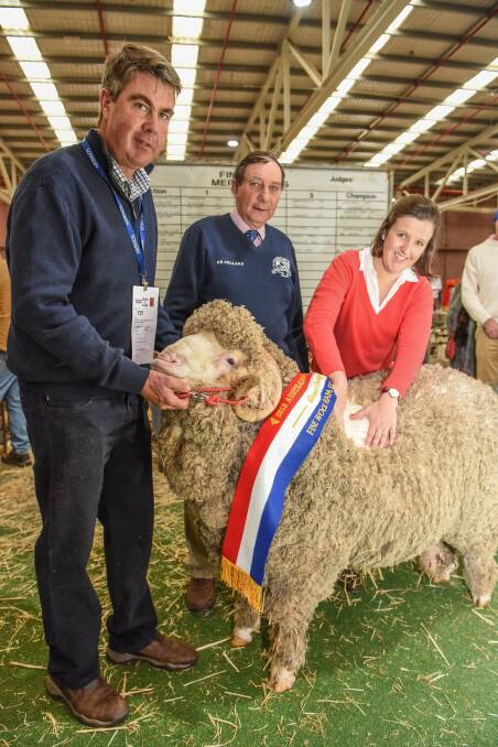 CHAMPION: Garry Cox, Langdene Merino stud, Dunedoo, NSW, with his champion fine wool Merino, with judges John Roberts and Anna Cotton. Photo by Laura Ferguson.