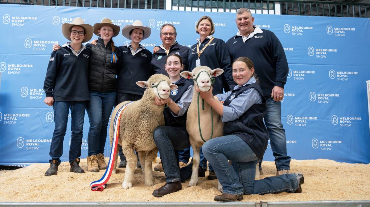 Finley High School students Bethany Loughridge, Kate Tilley and Maggie Bramley, agriculture teachers Gary Webb and Robyn O'Leary, principal Jeff Ward and kneeling students Erica Hammond and Cheyenne Tucker, with their interbreed champion ram and ewe. Picture by Branded Ag Marketing