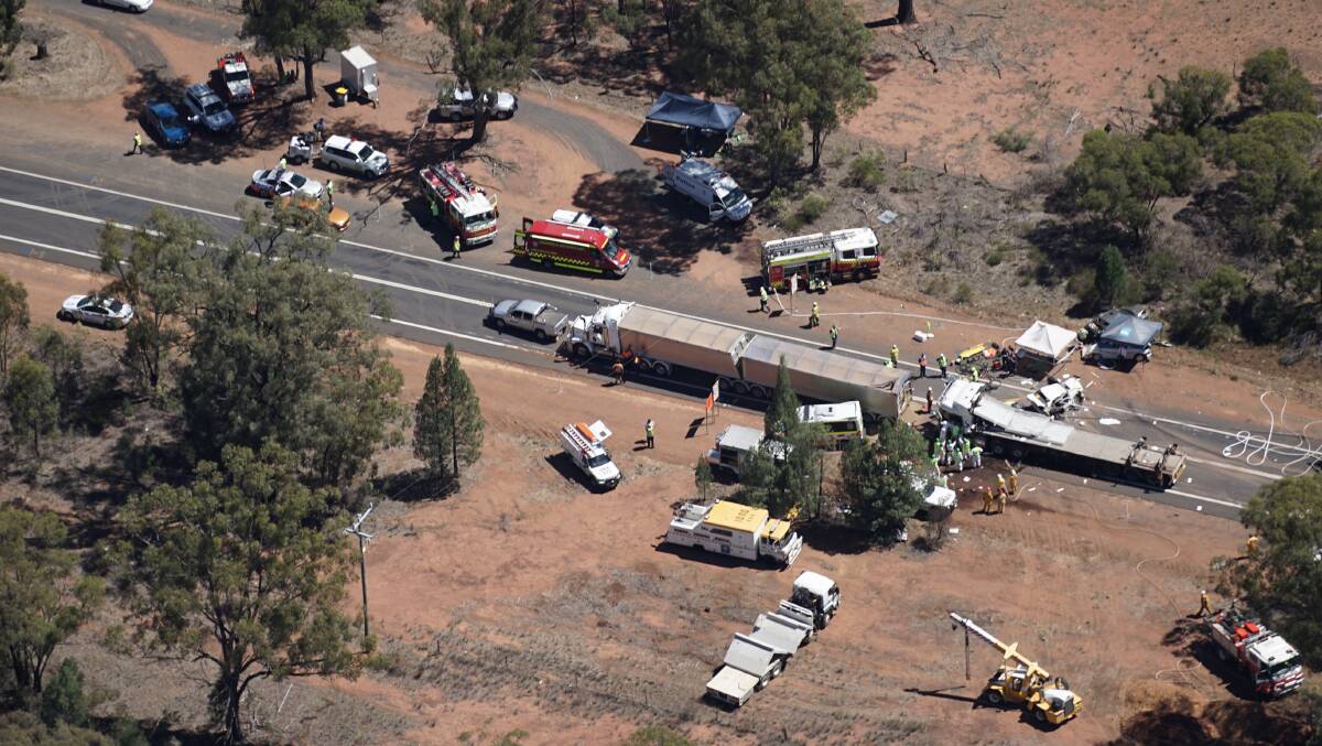 Emergency service crews at the scene of the fatal crash on January 16 near Dubbo. Photo: BRADLEY GUEST