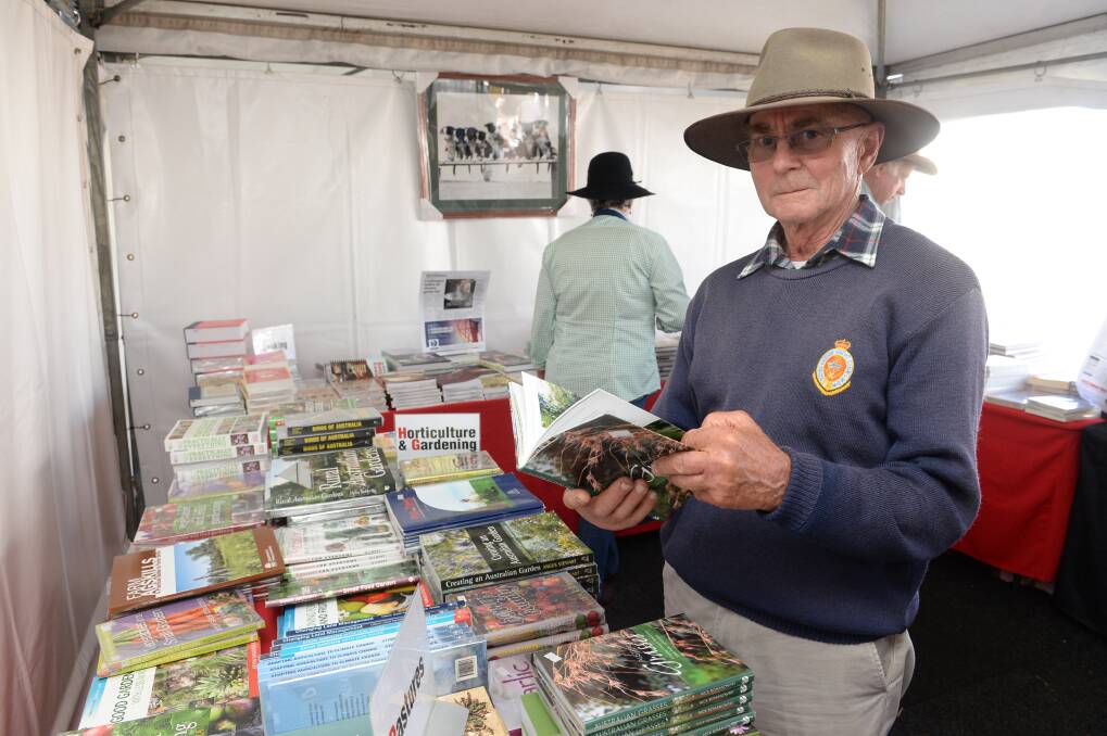 Brian Weis, Uralla, checks out books in The Land's Rural Bookshop last year.