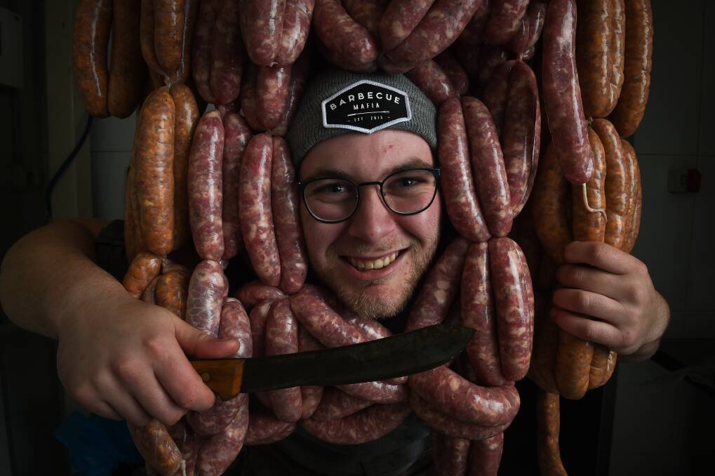 AWARD-WINNING: Borella Butchery owner Jared Gerahty with his gold medal winning parmy and Italian sausages. Picture: MARK JESSER