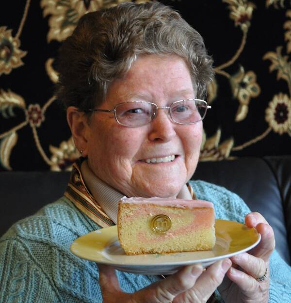Cudal’s Merle Parrish with her signature dish, peach blossom cake, and Masterchef immunity pin.