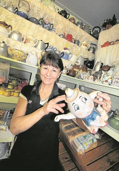 Leonie Bowden, owner and manager of Capitol Café, Stroud, with her teapot collection.