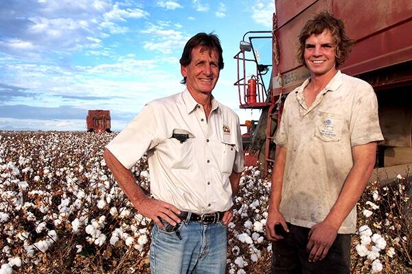 Continuing the family legacy, James Kahl and his son Sam pick the family’s 2012-13 season cotton at Wee Waa.