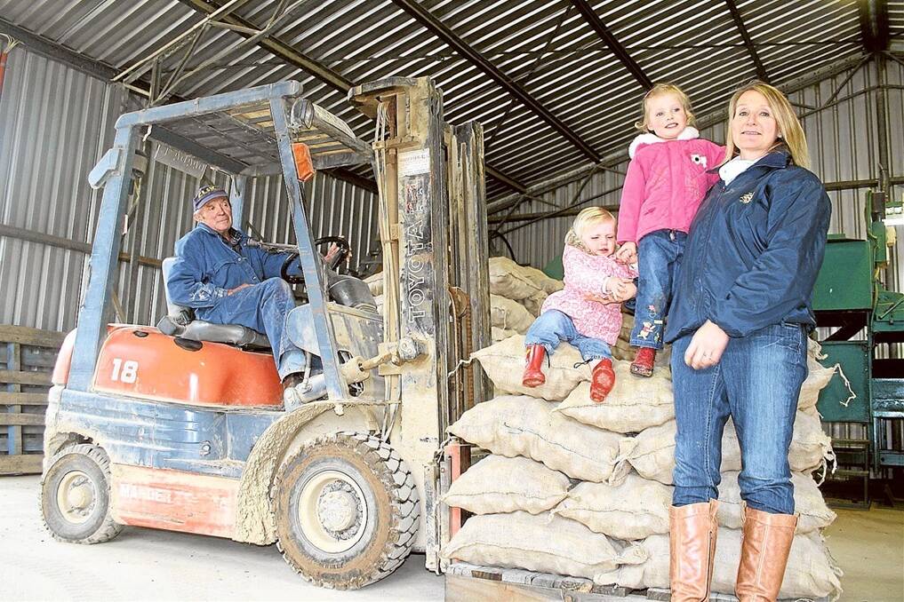 John Bensley, of Stillbrook Potatoes and Pastoral Company, Crookwell, with daughter-in-law Nicola and her children Charlie and Chloe. The Bensleys have been busy preparing to export 10 tonnes of potatoes to Fiji.