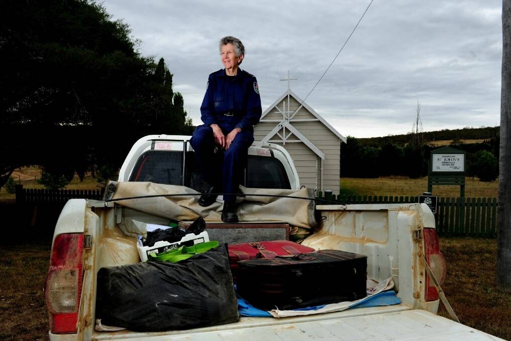 Rural Fire Service chaplain Jenni Roberts with the items she had decided to take with her if her home was destroyed in the January 2013 fires.