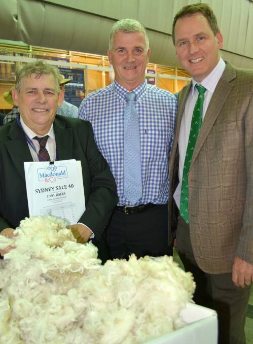 McDonald and Co auctioneer Ian Sharp with buyers Phil McAleer and Stuart Clayton, Modiano.