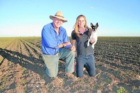 Patrick and Sally Downes with their dog Boots in their Sunbrook wheat, planted on Anzac day.