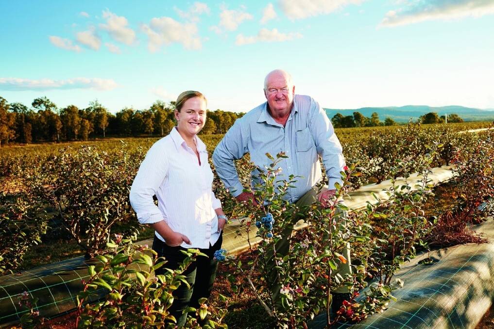 Ridley Bell and his daughter Natalie on the Mountain Blue Farms property. The family is releasing the new Eureka blueberry into Coles this month. 