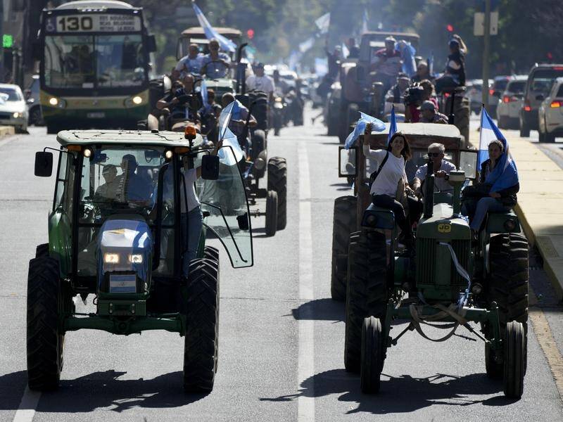 Farmers drive tractors through central Buenos Aires to to protest government policies and high taxes