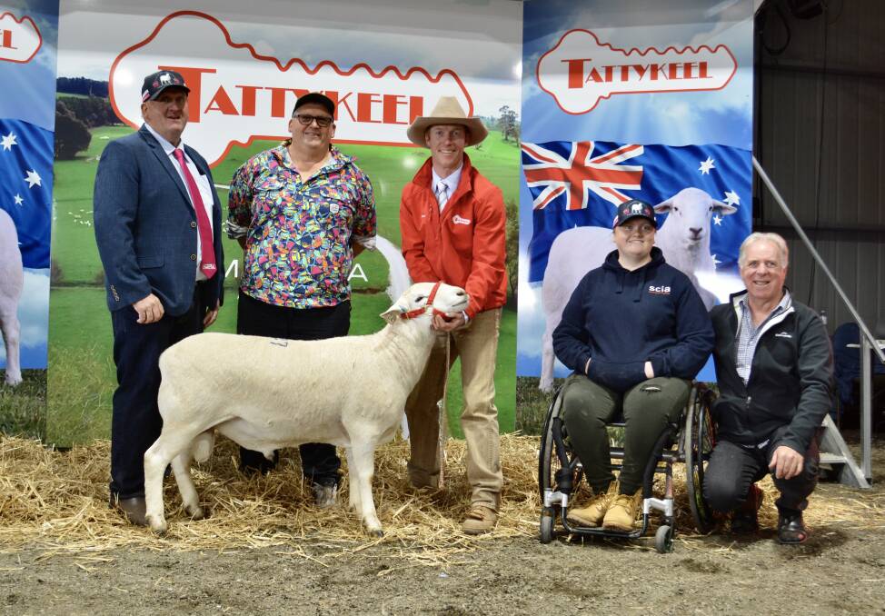 QPL's Craig Pellow, Phil Pellow, Tattykeel's James Gilmore, Jess Pellow and Spinal Cord Injuries Australia's Steve Macready with the $45,000 ram.