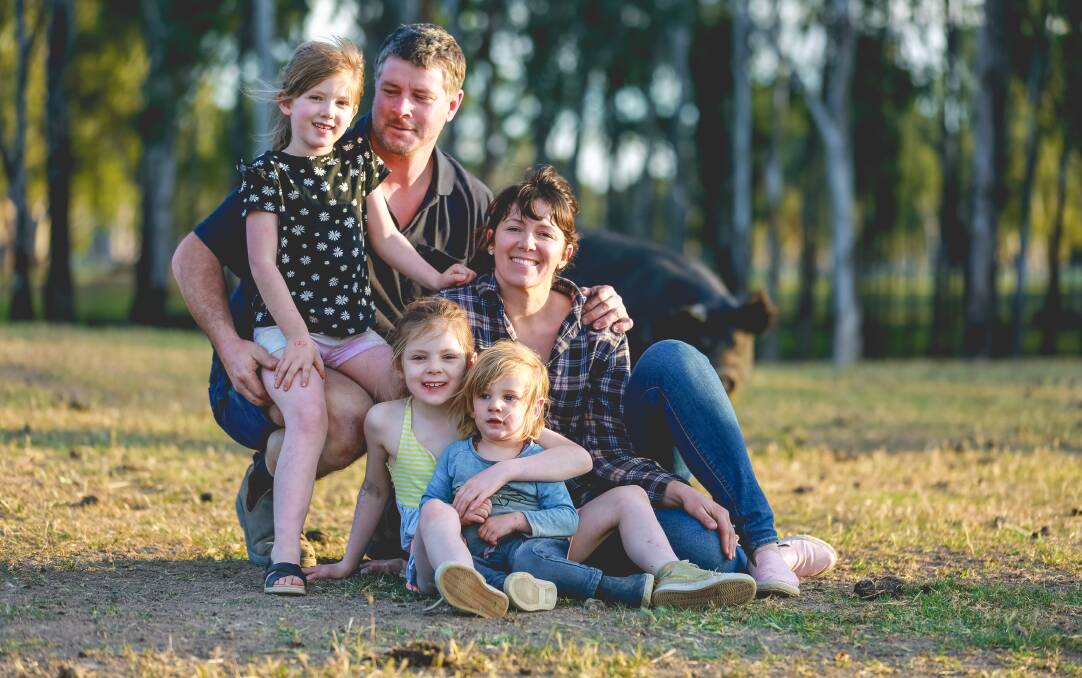 HAPPY AS PIGS IN MUD: Lachy and Lauren Mathers, Bundarra Berkshires, Barham, with their children Lucy, 9, Frida, 7, and George, 3. The family cuts and cures their free-range pork. Photo: Cindy Power.