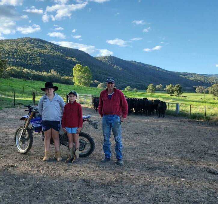 HELPING OUT: Stuart Greenhill, with the help of wife Ange and sons Jack, 11, and Eddie, 10, runs his Angus herd on the banks of the Murray River at Talmalmo. 