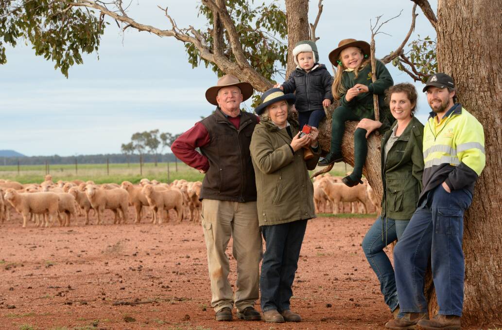 Richard and Linda Brangwin, "Evergreen", Condobolin, with their grandchildren Nicholas, 18 months, Hailey, 6, son and daughter-in-law David and Susi Brangwin, "Ruby Park", Condobolin, with their White Suffolk-cross lambs. 
