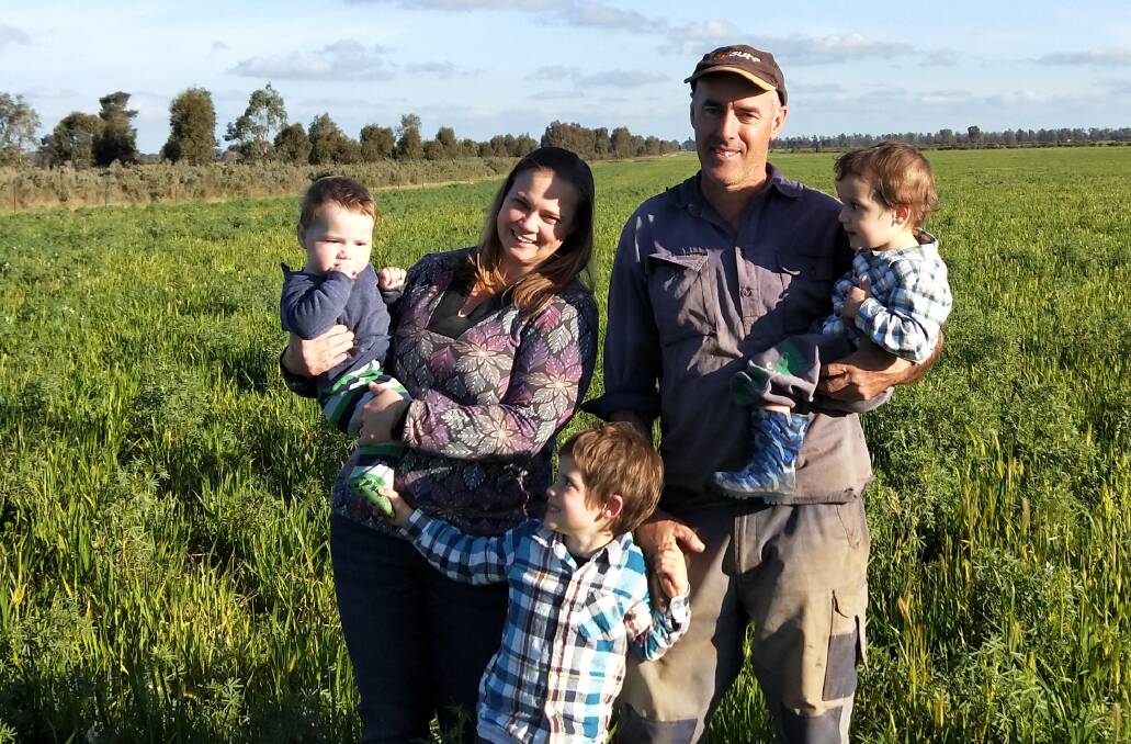 LITTLE HELPERS: Merino breeders Graham Strong and wife Amanda, Arcadia, Narrandera, with Geoffrey, 4, Cameron, 2, and Robin, 10 months.