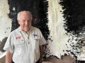 BLACK AND WHITE BEAUTY: John Ellis, Hanging Rock Speckle Park stud, Newham, Victoria, with one of their beautiful black and white hides, which are for sale at their cellar door.