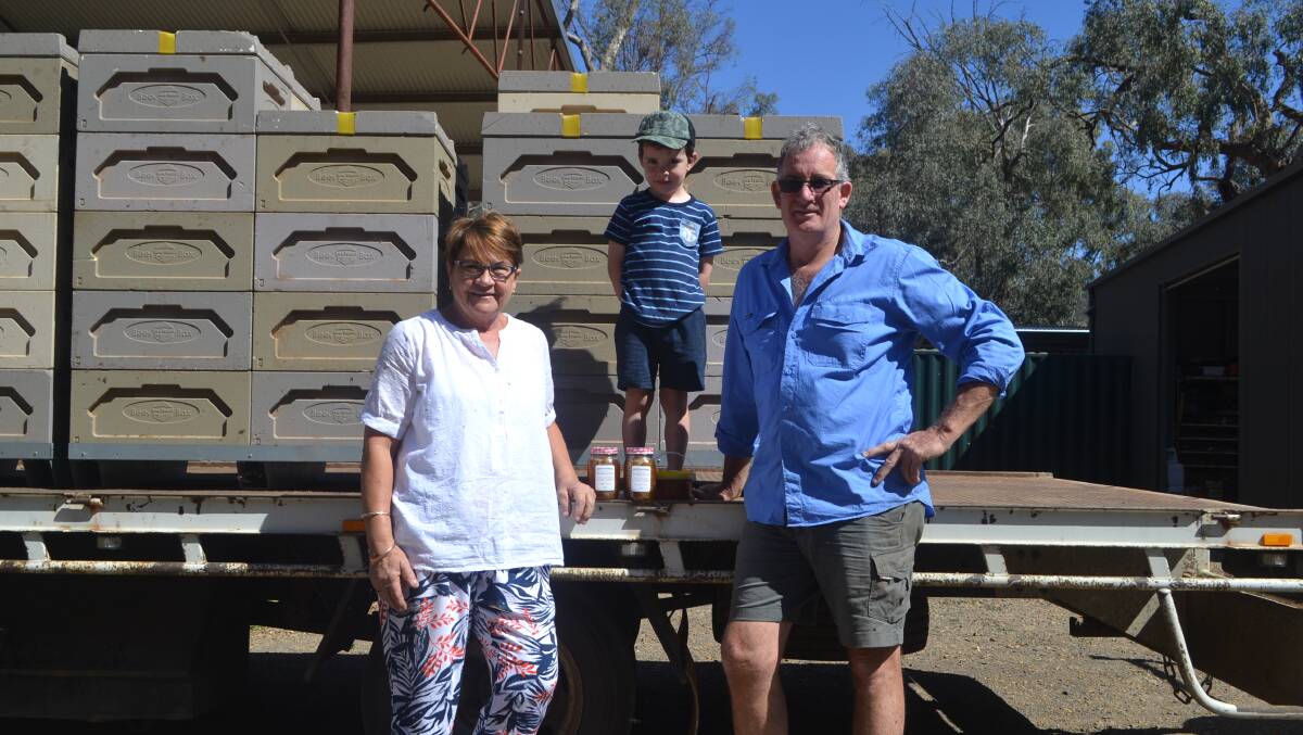 SWEET AS: Neil McMillan with his wife Jayne and grandson Robey with some of Honey Brothers products, available across the region.