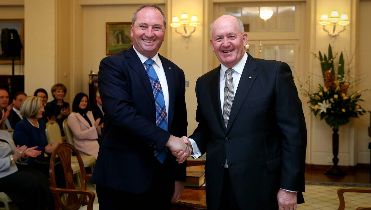IT's OFFICIAL: Deputy Prime Minister Barnaby Joyce is sworn in by Australian Governor General Sir Peter Cosgrove. Photo: Alex Ellinghausen. 