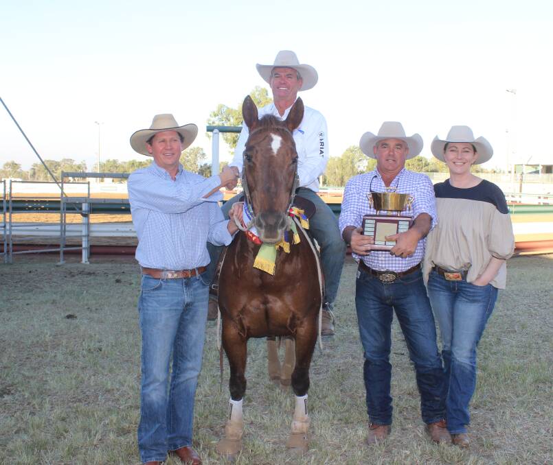 Brett Campbell, Mort and Co, Toowoomba presents the Mort and Co trophy to winner Pete Comiskey, Nebo astride Hankerchick, with proud owners Damien Kenny and Tory Acton. 