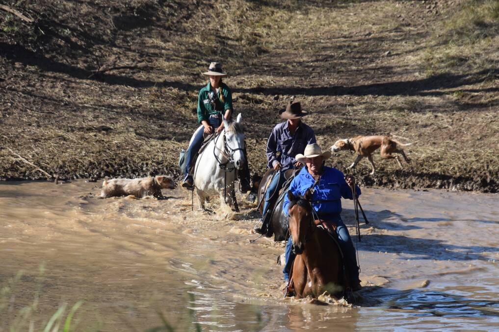 Boss drover Bill Little with ringers Baringa Blowers and Tehila Dardik crossing the Comet River, at Rolleston. Picture Trina Patterson Photography.