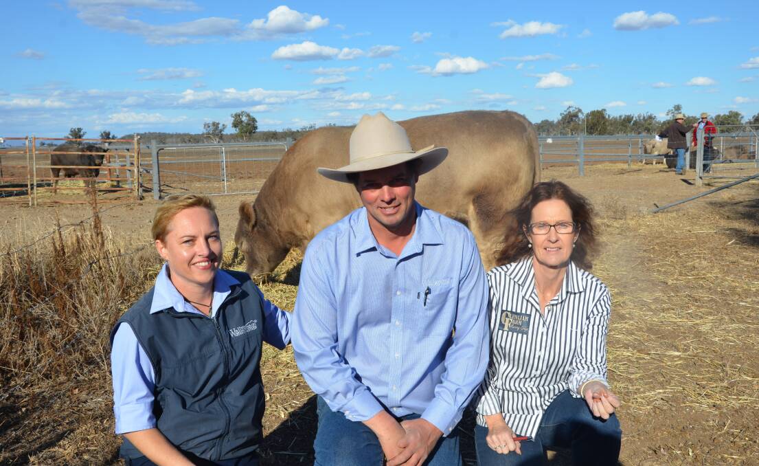 Wallawong Premium Beef co-principals Kate James, Lachlan James with Dianne Whale, Glenliam Farm Murray Greys in front of Lot 2, Wallawong Magic Man M47 who sold for $18,000.