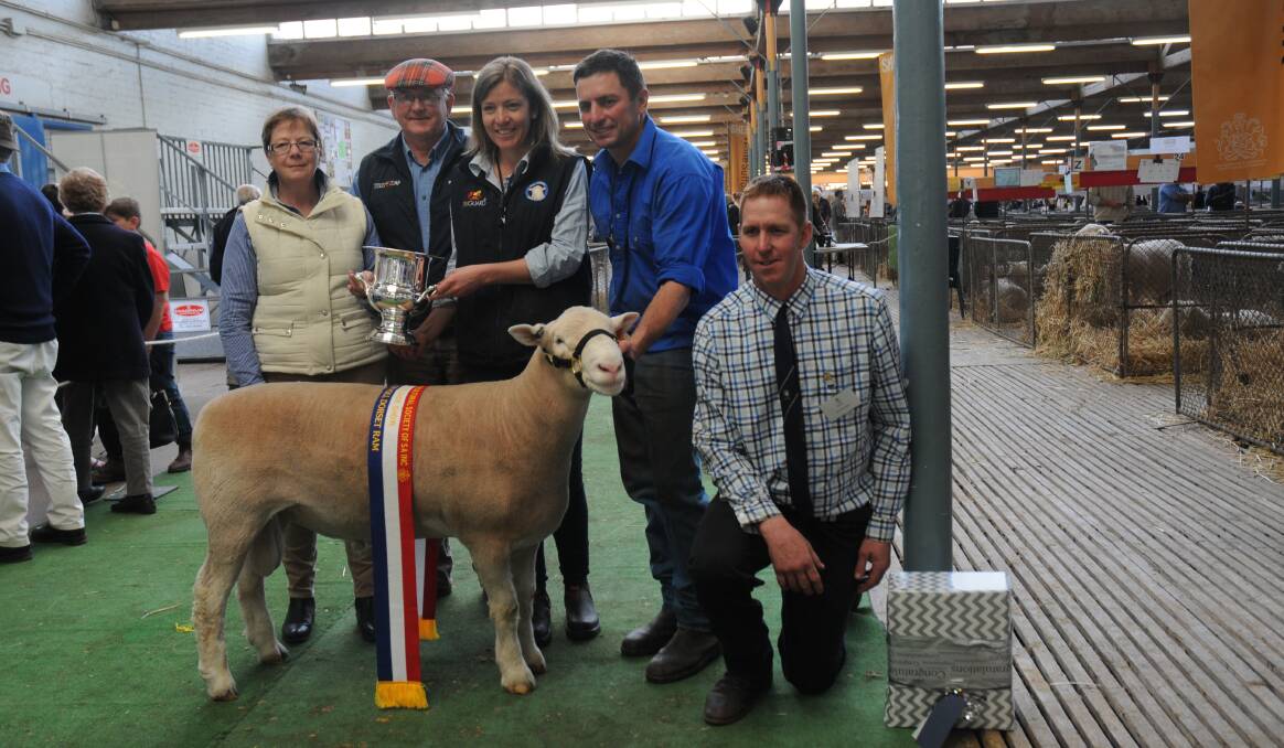 TOP WORK: Angela and Bill Close, Gawler River, presented grand champion ram trophy to Lucy and Ben Prentice, Ariah Park, NSW, and judge Tim Ferguson, Hopetoun, Vic.