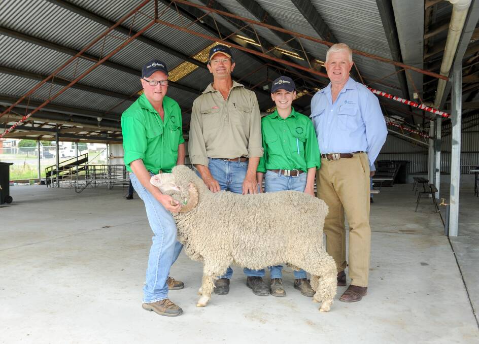 Glenburnie's Paul Pittman holds the top price ram secured by Bruce Taylor, with Bateson Pittman and AWN auctioneer John Croake. 