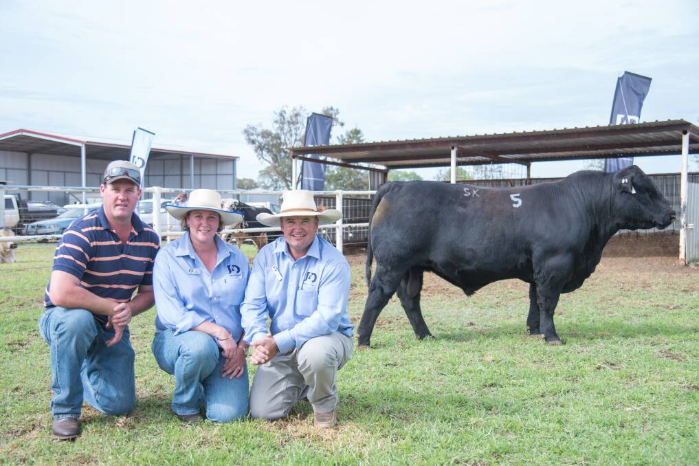 The $23,000 black Speckle Park world record bull with buyer Ben Wesley and vendors Amy and Justin Dickens of JAD Speckle Park stud. Photo: Ruby Canning of Emily H Photography 