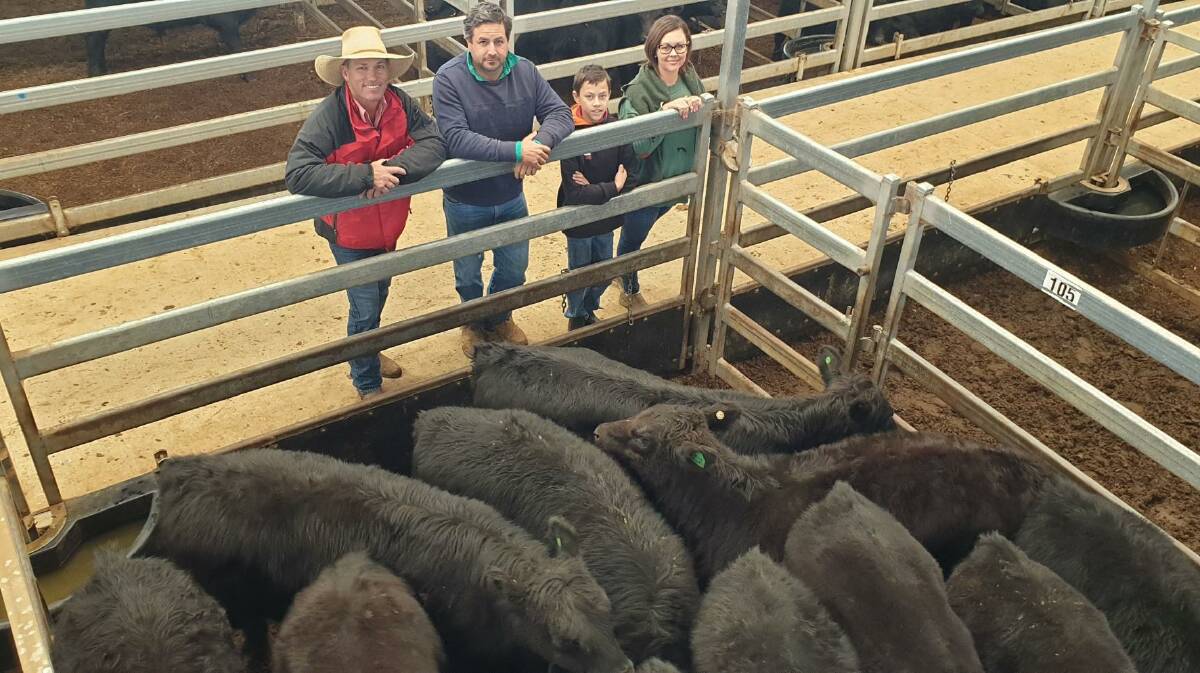 Elders Tamworth agent Shane Rule (image on right) congratulated Jordan, Tom and Kate Henry, Girraweena, Somerton when their Angus cross heifers made $1620. Photo: Michelle Mawhinney 