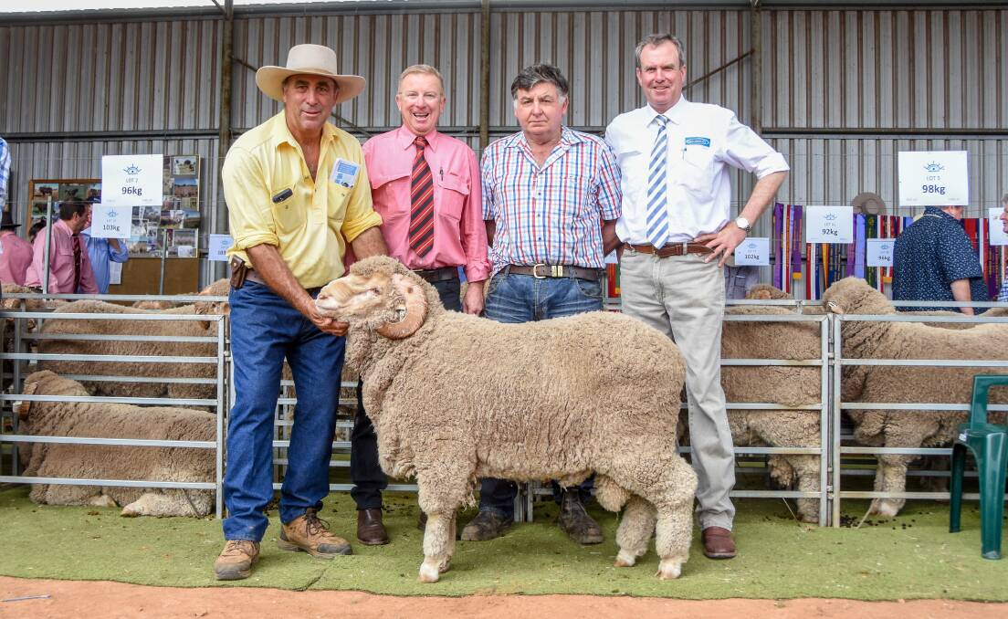 Bungulla Merinos principal Pete Capel with Elders New England Stud Stock agent John Newsome, buyer Brian Brazier, Wombang, Euchareena, and auctioneer Paul Dooley with one of Mr Brazier's top price purchases. 