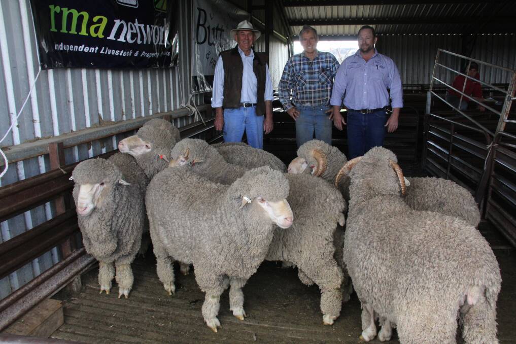 Buying seven rams was Bill West, Cowra, pictured with vendor Keith McGrath and Butt Livestock's Phill Butt. Photo: Butt Livestock