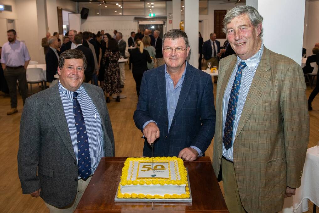 ABRI chairman Ian Locke, ABRI managing director Hugh Nivision and University of New England chancellor James Harris cut the 50 year celebration cake. 