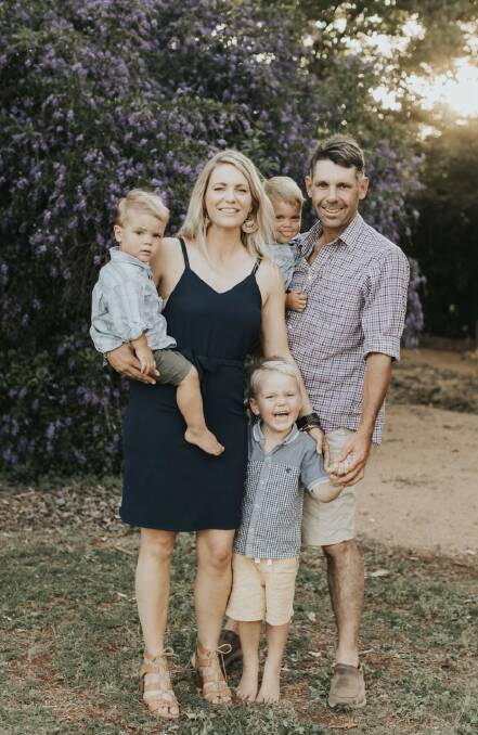 Felicity and Karl Burton with children Theo, Kory (standing) and Marcus. Felicity is one of three women on a mission to help bush medical patients and families. Picture supplied by Felicity Burton