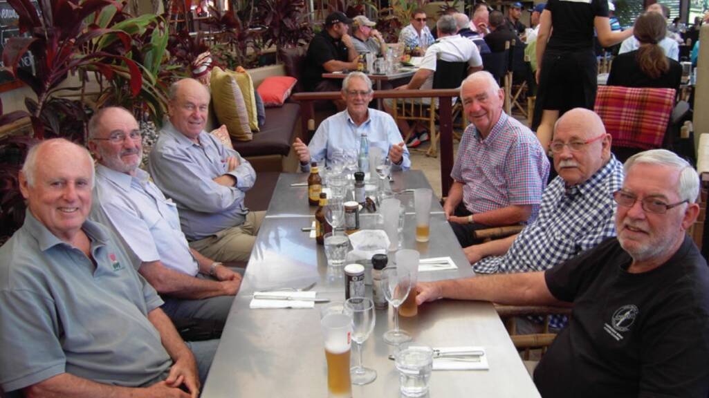 Dr Arthur Rickards at the head of the table and the 'magnificent seven' from the University of Queensland. 