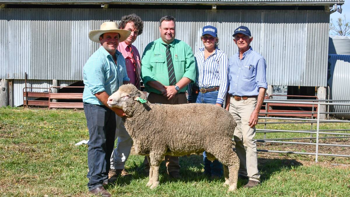 Cassilis Park stud principal James Armstrong with Elders agent Brett Smith, Nutrien auctioneer Brad Wilson, top price buyer Georgia White, Talbragar, Coolah and Cassilis Park stud principal Cam Armstrong with the $6400 Poll Merino ram. 
