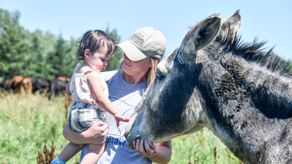 Karlie and her daughter with one of their protection donkeys. 