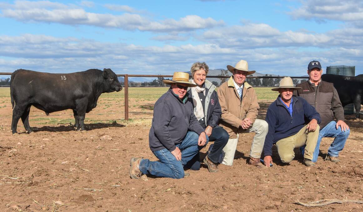 The $9000 Booragul General N130 with new owners, Mark and Lee Latham, Goodwood, Curlewis, auctioneer Paul Dooley, Booragul stud principal Tim Vincent and agent Tim Walsh.