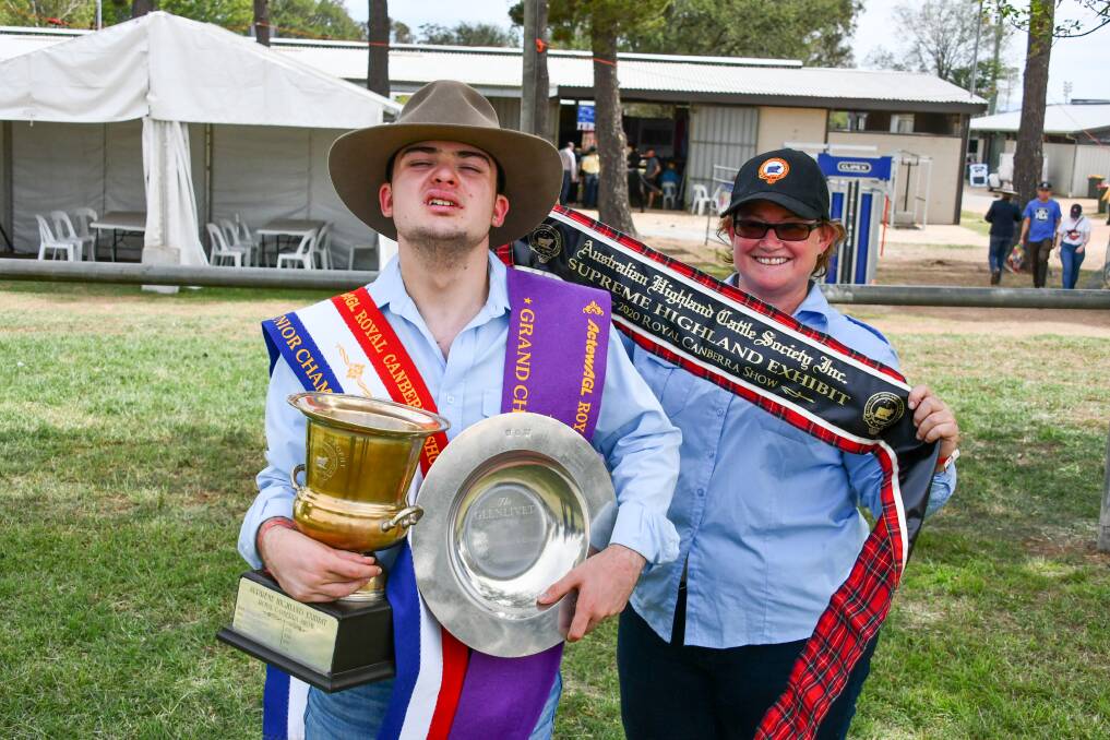 Melbourne's Will Pierce with Highland breeder Erica Smith and their winnings from the Royal Canberra Show. 