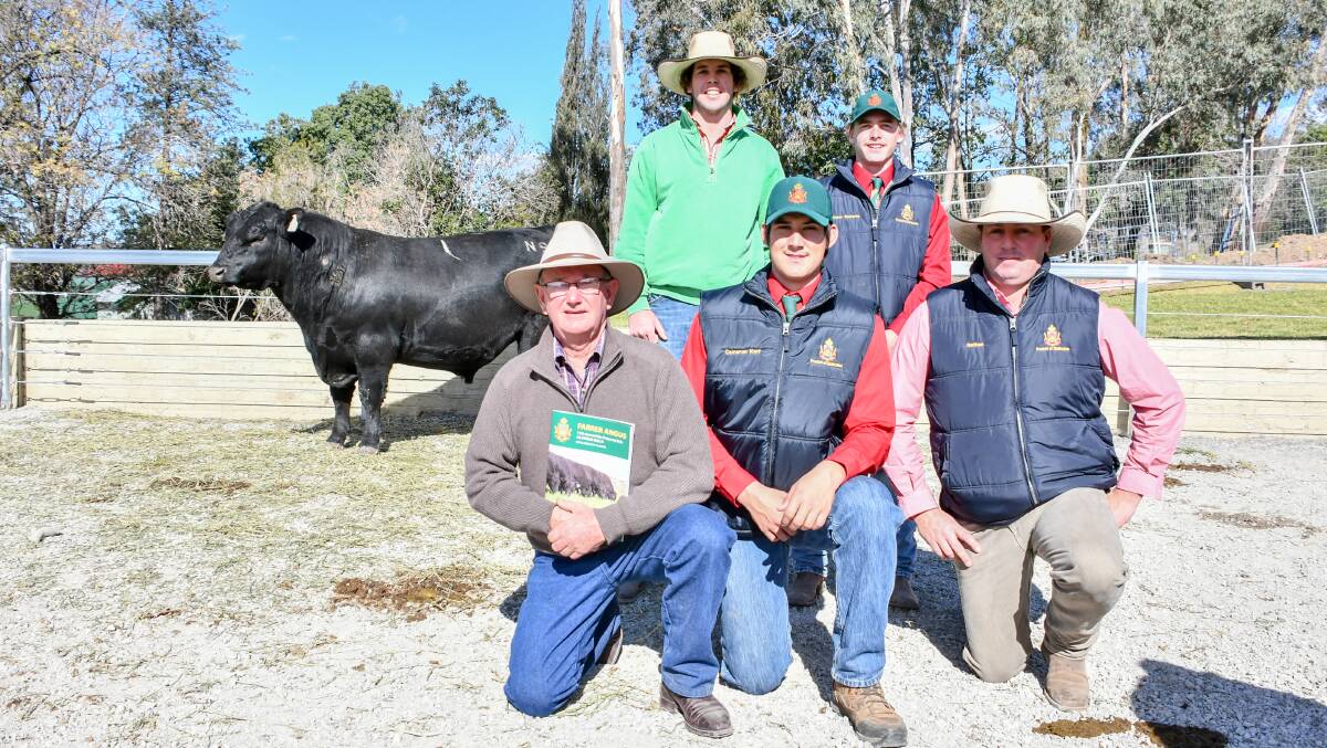 Top price bull Farrer N9 with purchaser Herb Duddy, Sara Park Angus, Glen Innes, and Alex Bruce, Glen Innes, with Farrer students Cameron Kerr and Matt Roberts, and Elders Tamworth agent Nathan McConnell. 