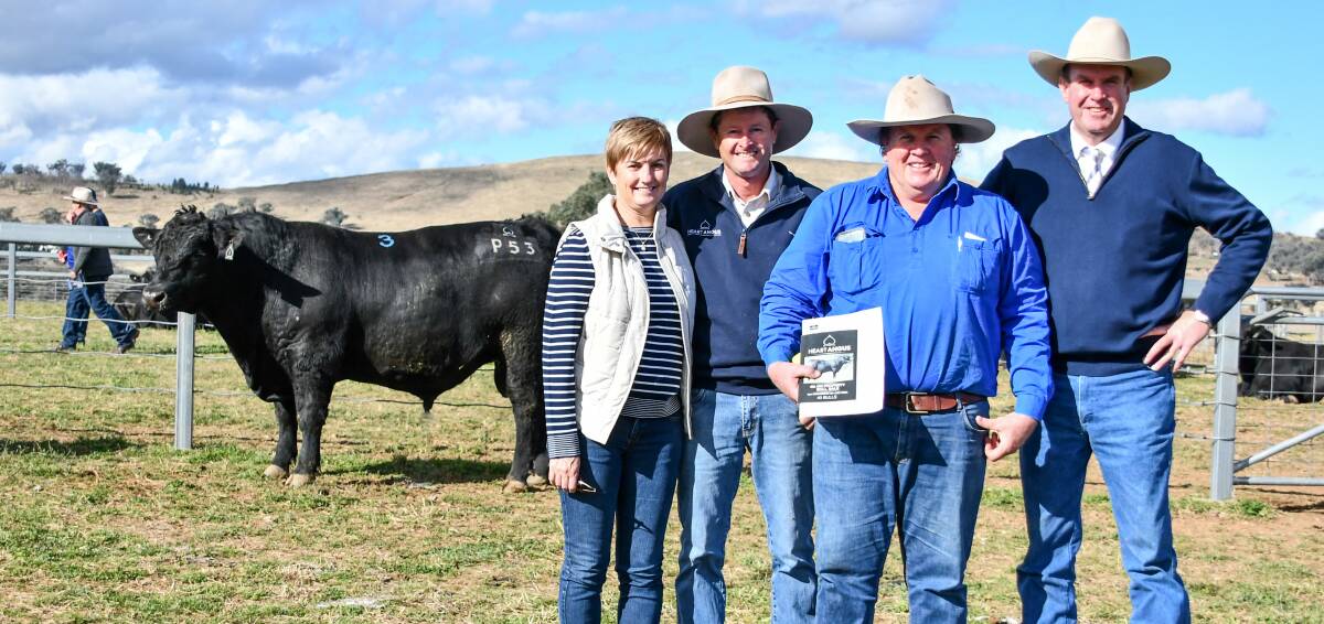 The $13,000 top price bull with vendors Natalie and Chris Paterson, buyer Nicholas Morgan of Glenmorgan Angus at Llangothlin and auctioneer Paul Dooley. 