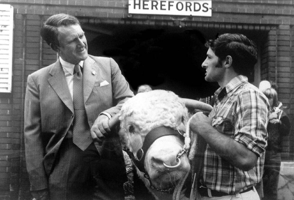 Former PM Malcolm Fraser inspects the grand champion Hereford, Bolong Kimbo, at the Sydney Royal in 1978 with owner, Peter Croker, Taralga.