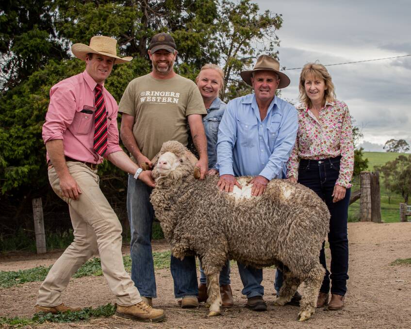 David Simpson of Elders Bathurst with buyer Grant and Karin Toole from Spartan Pastoral and Blink Bonnie stud principals Peter and Kaye Moore. Photo: Kirby McPhee