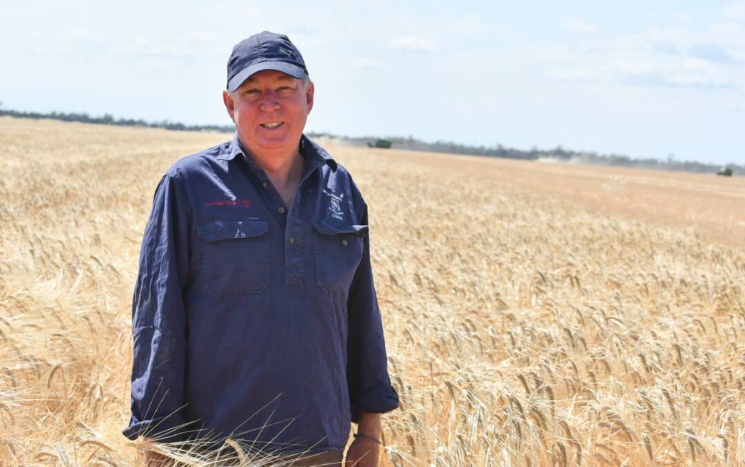 Qantas pilot Lindsay Menkens of Brisbane is working hard this harvest, helping out on a property at Moree. 