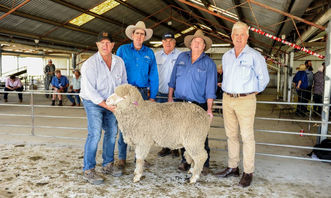 Airlie principal Murray Power with buyer Michael Evans, Schute Bell auctioneer Graham Andrews, buyer Paul Evans and AWN's John Croake and the $5200 ram. 