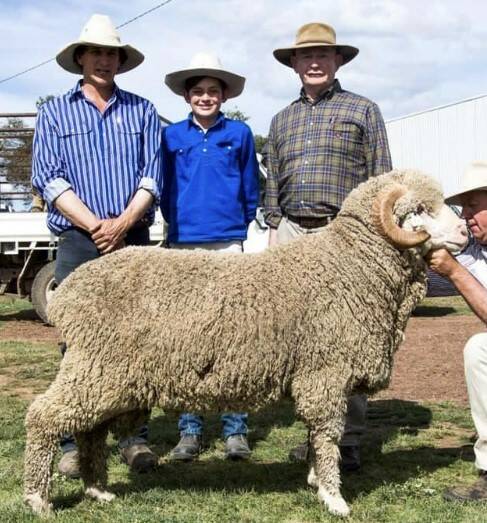 One of the top price rams (lot 21) with vendor Nigel Roberts, Dunbogan Merino stud, buyers Thomas Vickers and Colin Blackhall, Cumnock. 