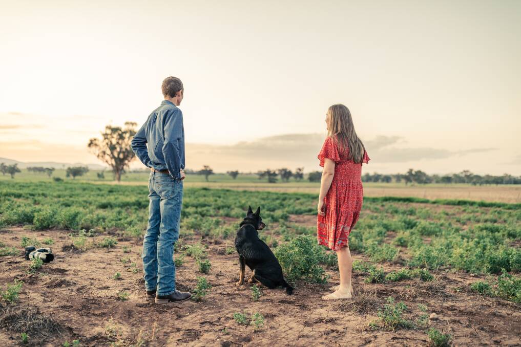 Murray Stirling and Emily Bowler with Rocky the kelpie on the family farm Wheatacres at Birthramere. It was a beautiful evening overlooking the plains at their engagement shoot.