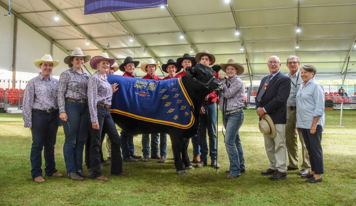 Murrumburrah High School students with their charity steer, Schute Bell's John Gray and buyer representatives Gary and EJ Williamson. 