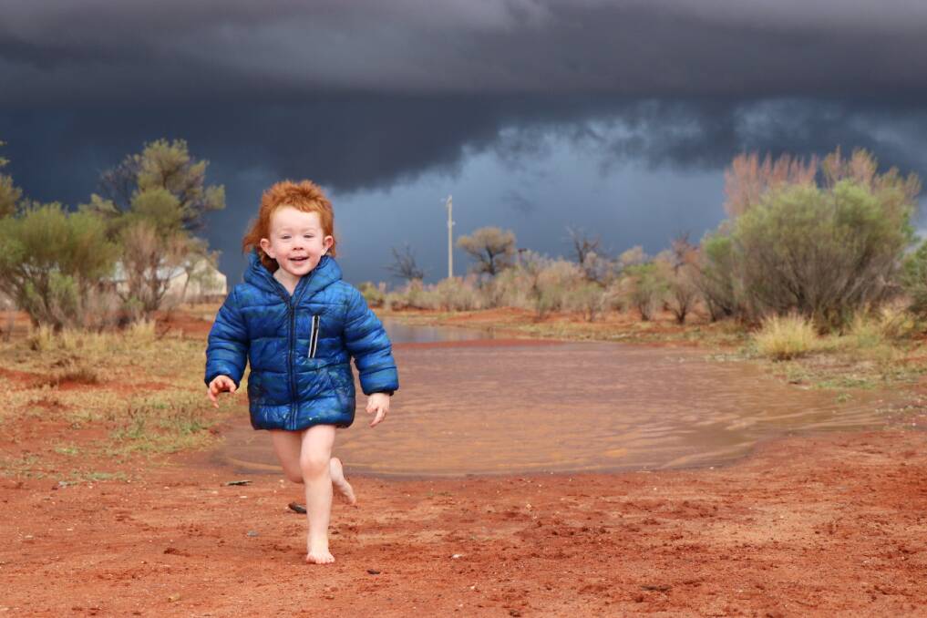 Colour open age winner - Playing in the puddles by Brigitte OConnor.