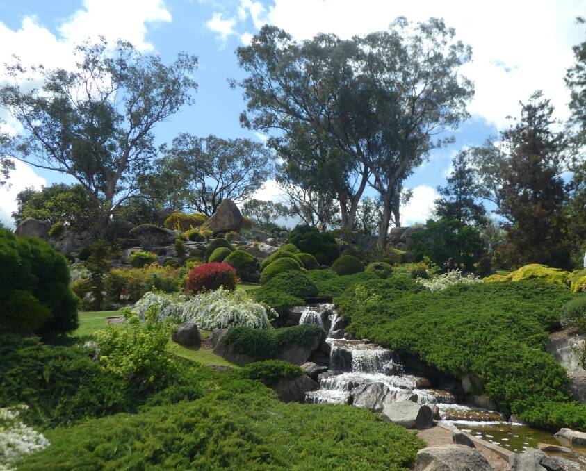 The stream in Cowra's Japanese Garden follows a symbolic transition from a mountain top, through meadows, forests and lakes, to the cultivated seashore.