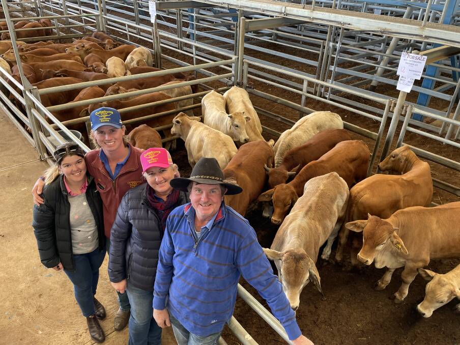 The McGrath family, Cuttaburra Pastoral Company near Bourke, sold 420 cattle during the Forbes store sale last Friday. Sandy and Dale McGrath (right) are with their son Ben (second from left) and his partner Emma Cunningham (far left) and a pen of Beefmaster steers that sold for $1510 a head.